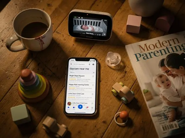 Parent browsing daycare sites on phone